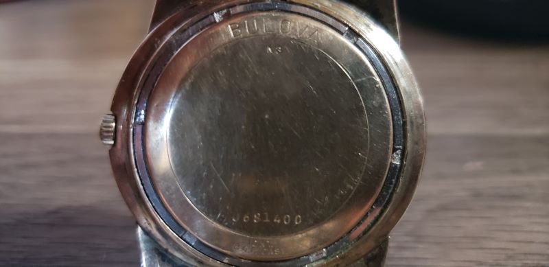 Back with serial number, year code and material description